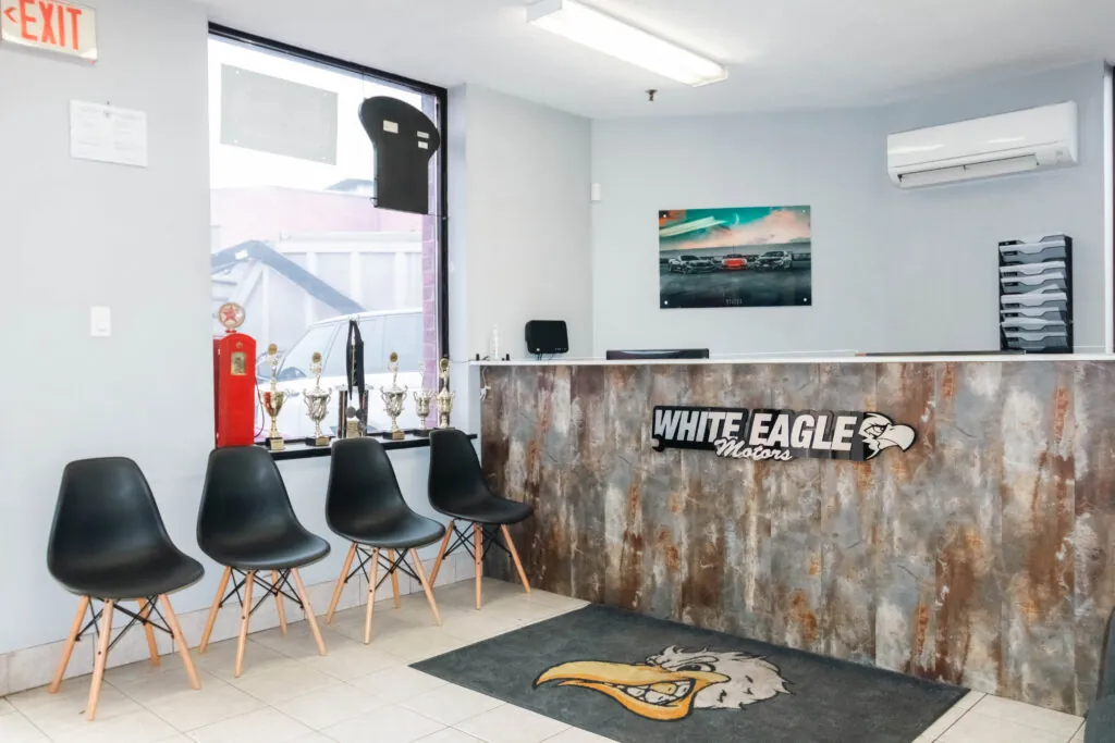 Customer waiting area with trophies by the front desk